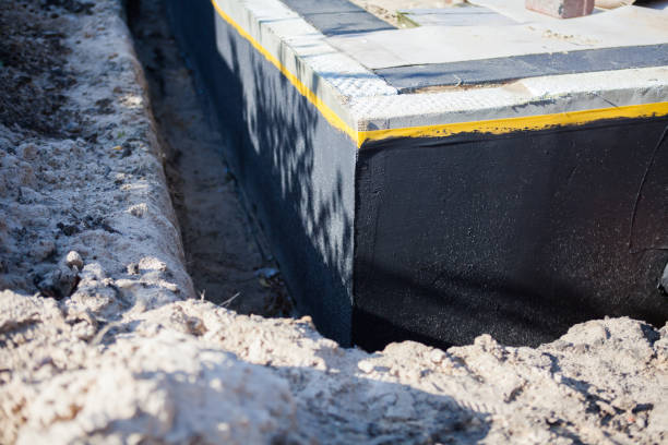 Professional Basement Waterproofing technician working in Forest Hill, MD